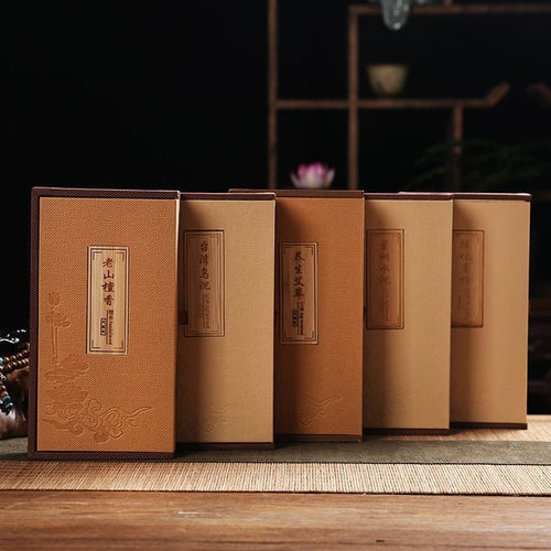 Glow & Drift Aura Capsule Ritual Box set featuring five linen-textured book-style incense storage cases.