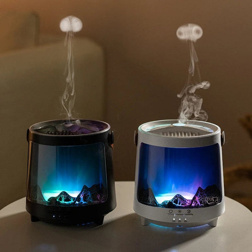 Glow & Drift Aurora Mist & Flame Diffuser pair in black and white with jellyfish mist effect and mountain landscape