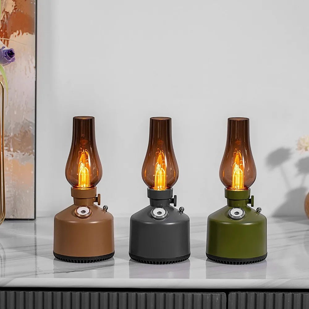 Glow & Drift Beacon Retro Lantern diffusers in brown, grey, and green with amber glass shades and warm filament lighting.