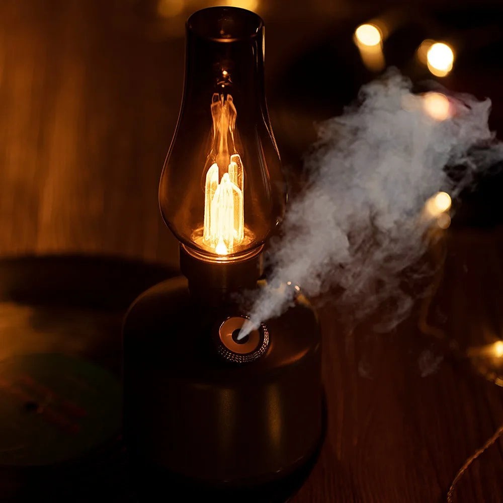 Glow & Drift Beacon Retro Lantern humidifier with a warm glowing filament and mist emitting from the base.