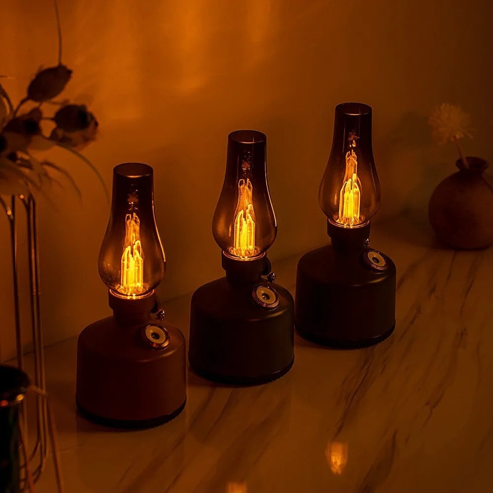 Glow & Drift Beacon Retro Lantern humidifiers with warm filament glow and smoked glass on a marble surface