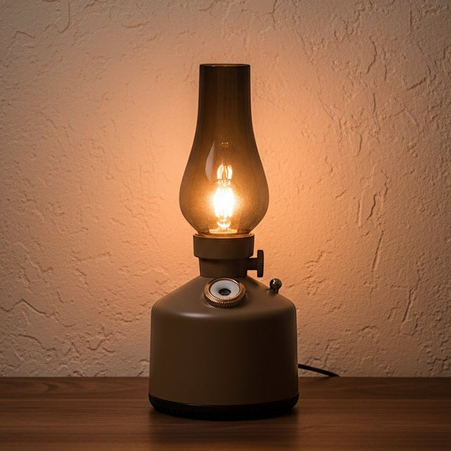 Glow & Drift Beacon Retro Lantern humidifier with a warm glowing filament light and smoked glass top on a wooden table.