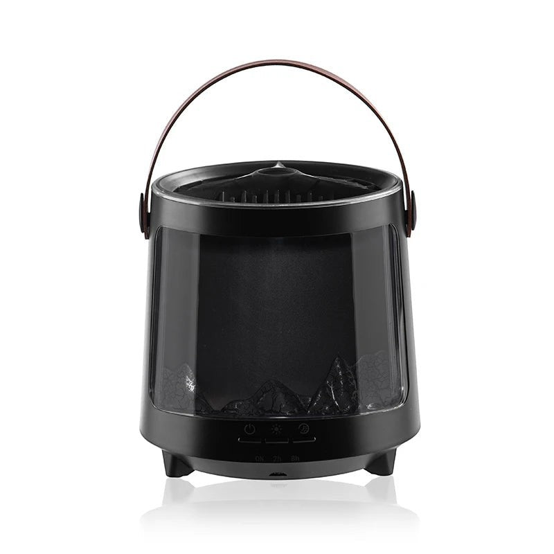 Glow & Drift Aurora Mist & Flame Diffuser in black with a mountain landscape window and a brown carrying handle.
