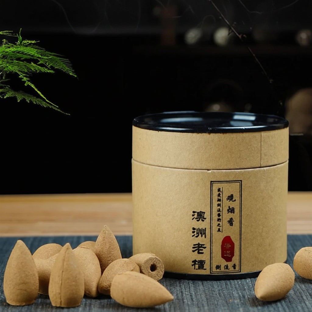 Glow & Drift botanical incense cones in a minimalist cylindrical cardboard canister for backflow burners