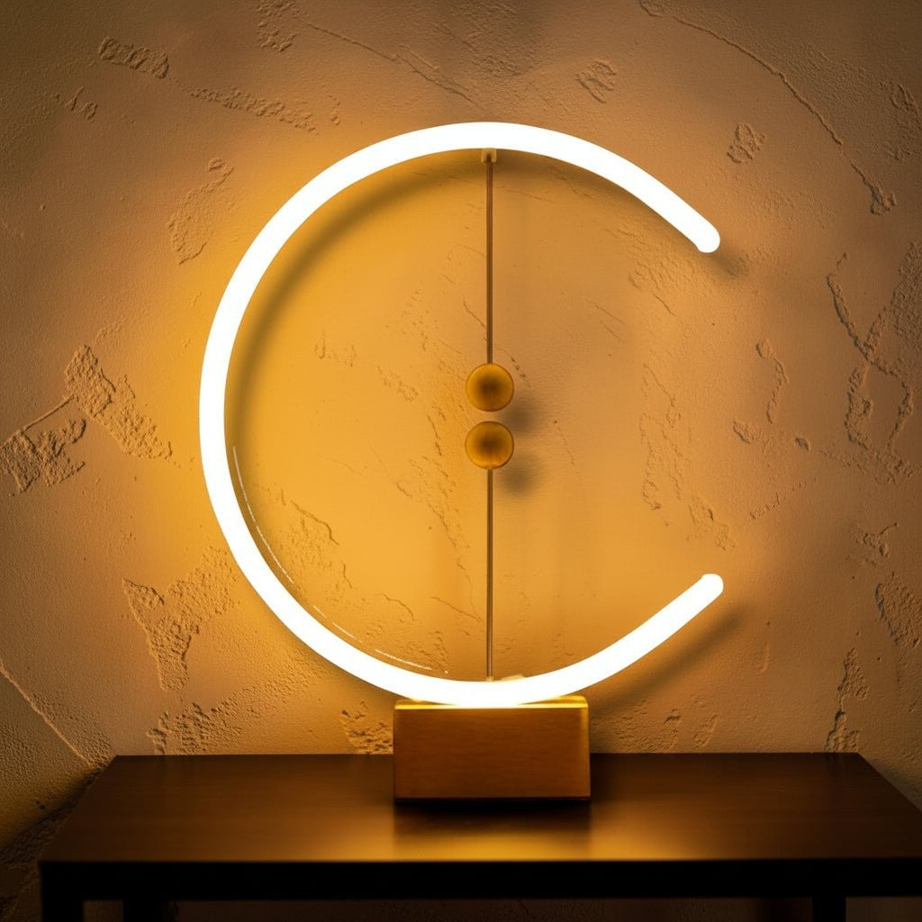 Glow & Drift Crescent Magnetic Balance Lamp with a glowing LED halo and suspended wooden spheres on a beech wood base.