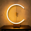 Glow & Drift Crescent Magnetic Balance Lamp with a glowing LED halo and suspended wooden spheres on a beech wood base.