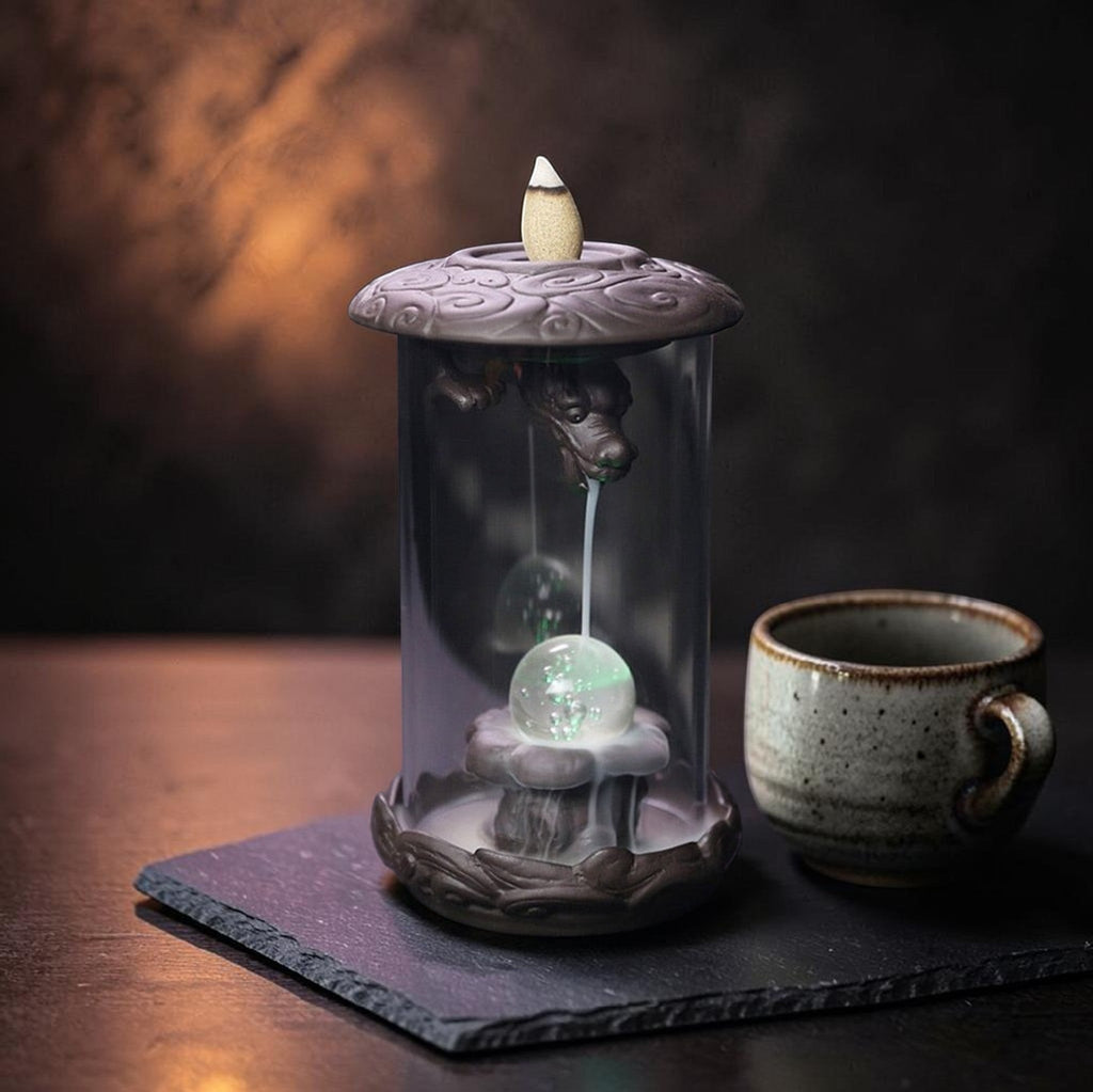 Glow & Drift Aurelian Dragon Glass Tower incense burner with Zisha clay dragon, glass cylinder, and glowing orb.