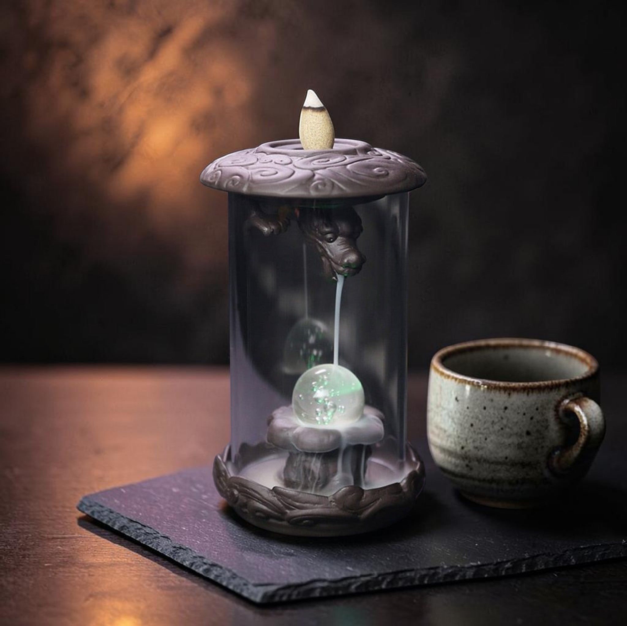 Glow & Drift Aurelian Dragon Glass Tower incense burner with Zisha clay dragon, glass cylinder, and glowing orb.