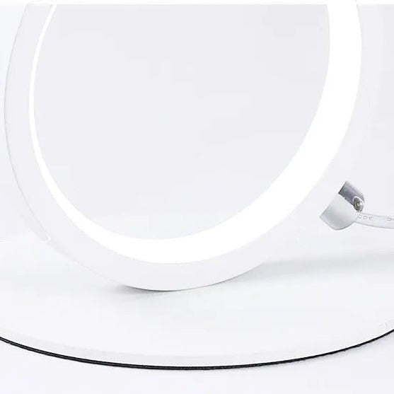 Glow & Drift Eclipse Triple Ring Table Lamp featuring a minimalist white circular design on a flat base