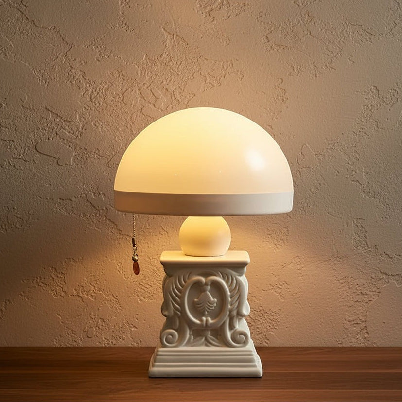 Glow & Drift Elysian cordless table lamp with a neoclassical carved resin base and a soft-glowing dome shade.