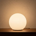 Glow & Drift Ethereal Orb Lamp featuring a frosted spherical acrylic shade emitting a warm, diffused ambient glow.