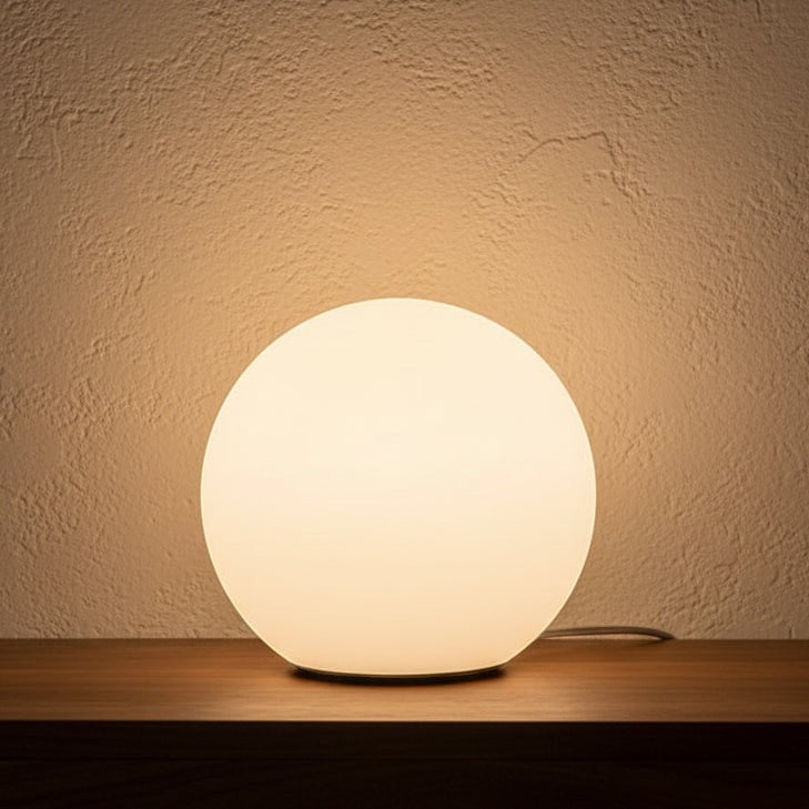 Glow & Drift Ethereal Orb Lamp featuring a frosted spherical acrylic shade emitting a warm, diffused ambient glow.