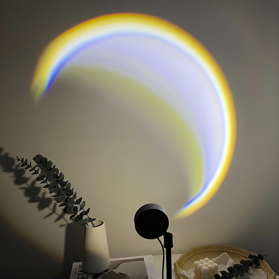 Moonlight Projection Lamp casting a crescent moon effect on a neutral bedroom wall.