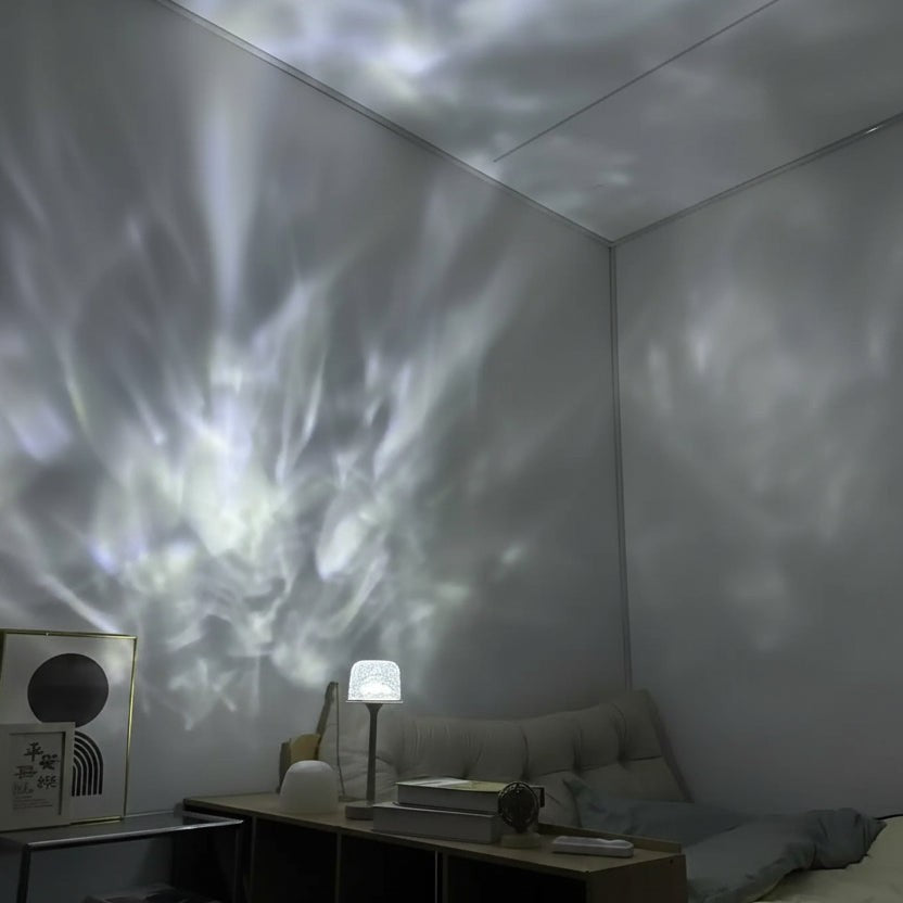 Glow & Drift Ocean Aura Projector Lamp casting dynamic water ripple light effects on a bedroom wall and ceiling
