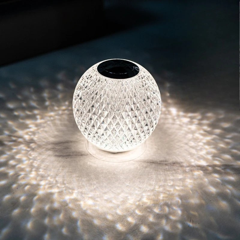Glow & Drift Prism Crystal Atmosphere Lamp with a faceted diamond-cut design casting a patterned light on a surface.