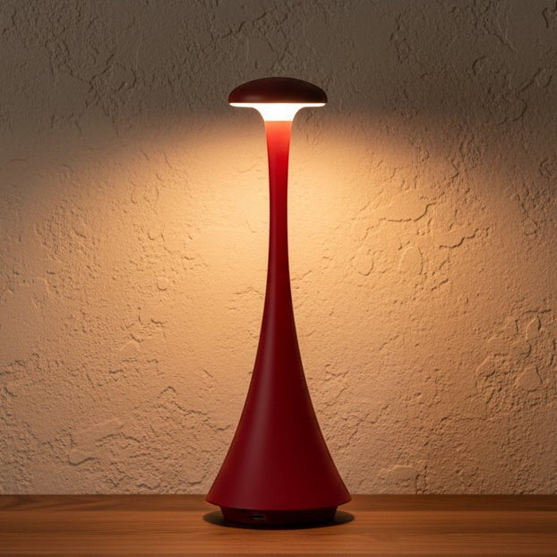 Glow & Drift red portable mushroom lamp with a tall, minimalist silhouette casting a warm, soft ambient glow.
