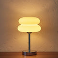 Glow & Drift Retro Macaron Glass Lamp with a sandblasted mushroom shade and polished steel base emitting warm light.
