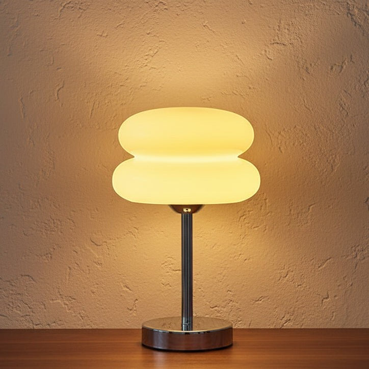 Glow & Drift Retro Macaron Glass Lamp with a sandblasted mushroom shade and polished steel base emitting warm light.