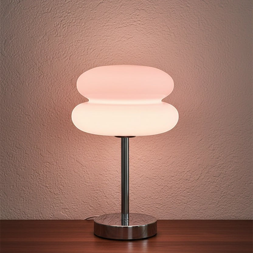 Glow & Drift retro macaron glass lamp with a sandblasted mushroom shade and polished steel base glowing in warm light.