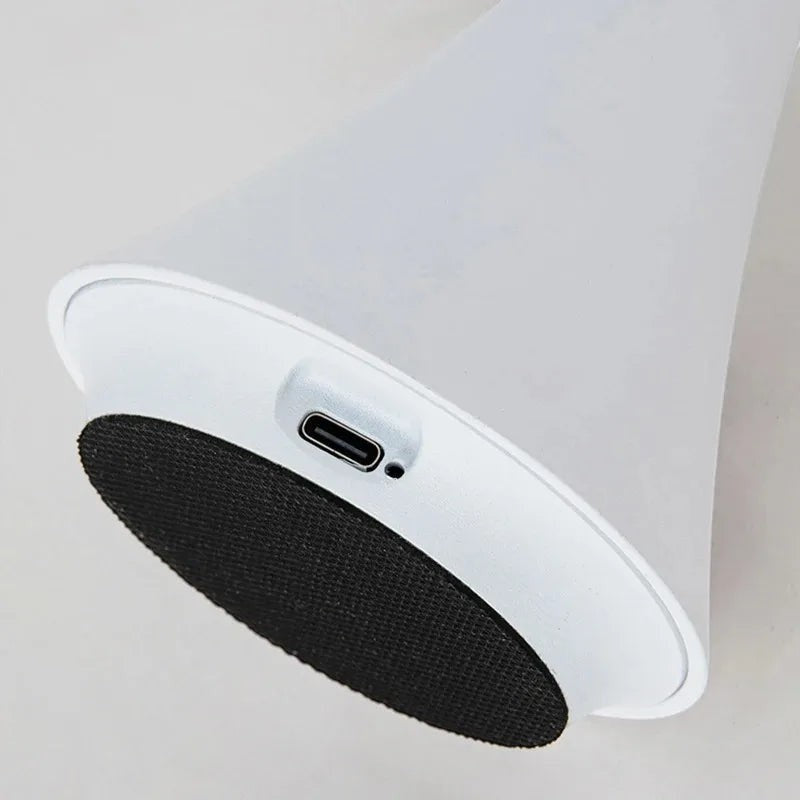Glow & Drift Spora portable mushroom lamp base showing the USB-C charging port and non-slip black rubber pad