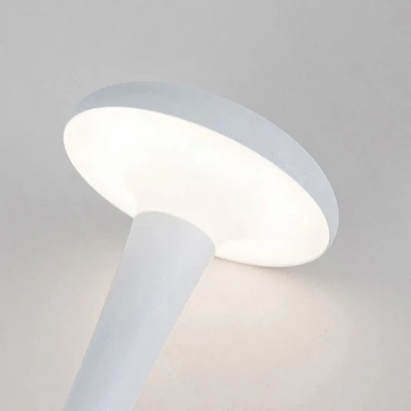 Glow & Drift Spora portable white mushroom lamp with a smooth matte finish and soft ambient glow.