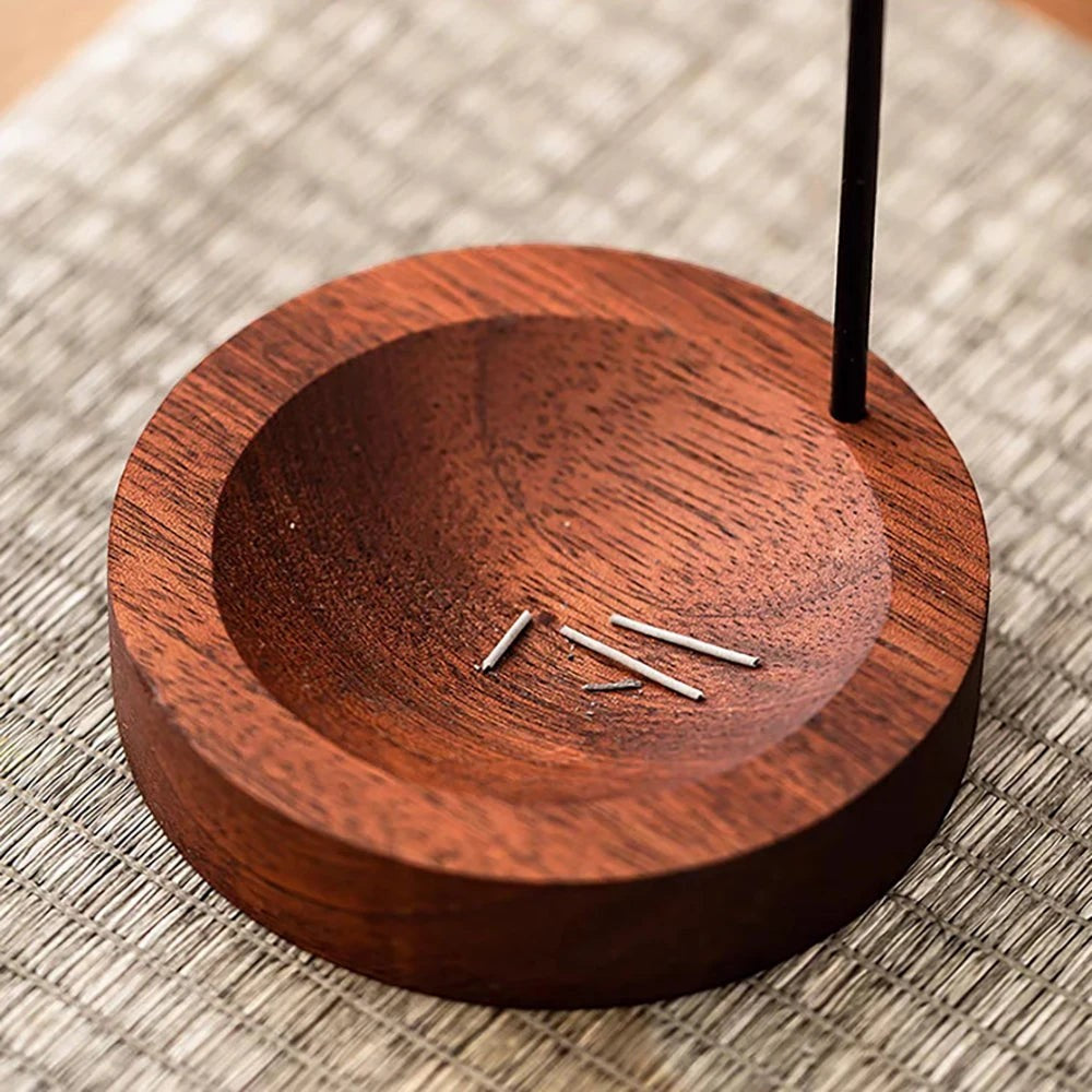 Glow & Drift Equinox walnut wood incense stand with a round ash-catching basin and vertical stick holder