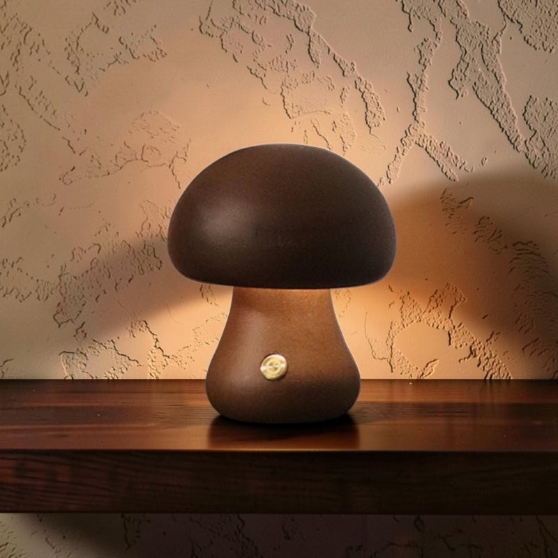Classic dome walnut Glow & Drift minimalist wooden mushroom lamp with a warm LED glow on a dark wooden bedside table.