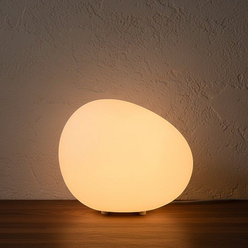 Glow & Drift Zen Riverstone ambient lamp with a smooth, frosted acrylic cobblestone shape emitting a warm, soft glow.