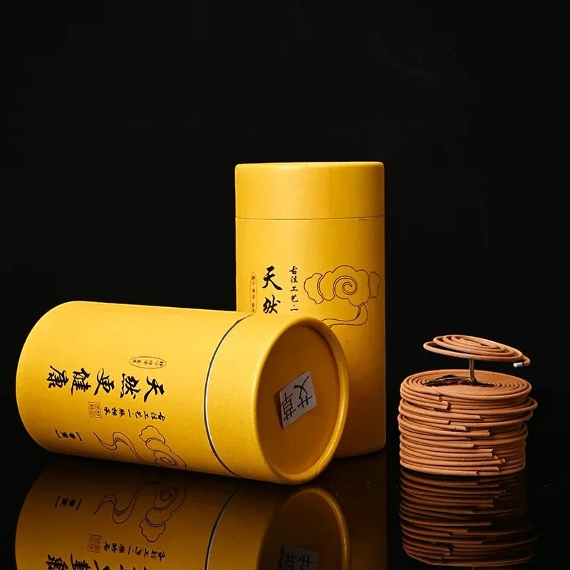 Glow & Drift Zenith Ritual Coil Incense with natural botanical spiral coils and yellow cylindrical storage canisters.