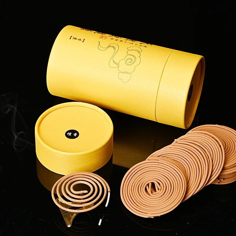 Glow & Drift Zenith Ritual Coil Incense set with natural botanical spiral coils and a yellow cylindrical storage box.