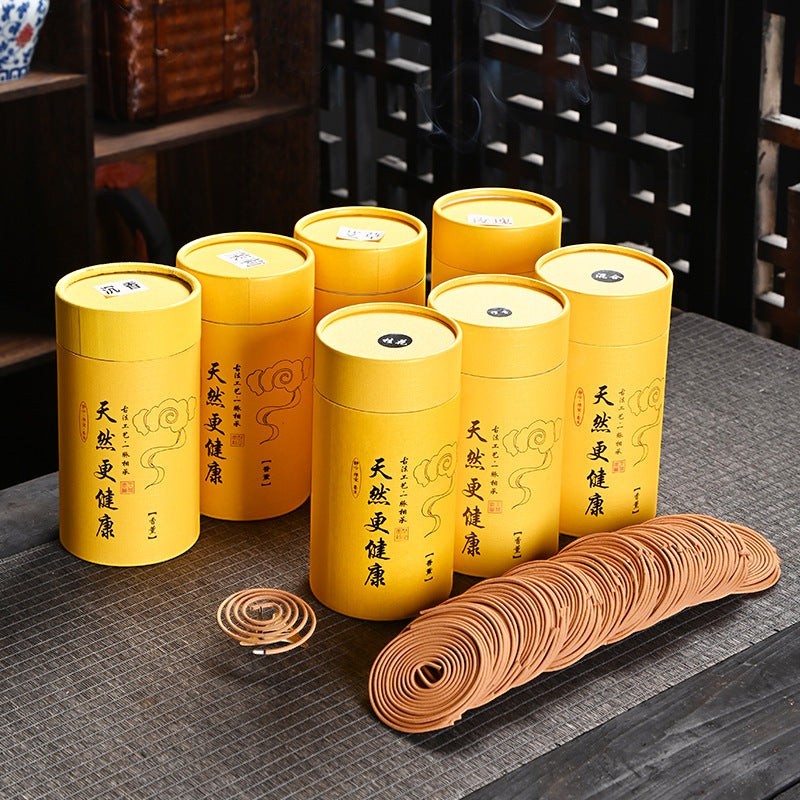 Glow & Drift Zenith Ritual Coil Incense set with yellow cylindrical canisters and brown spiral incense coils on table