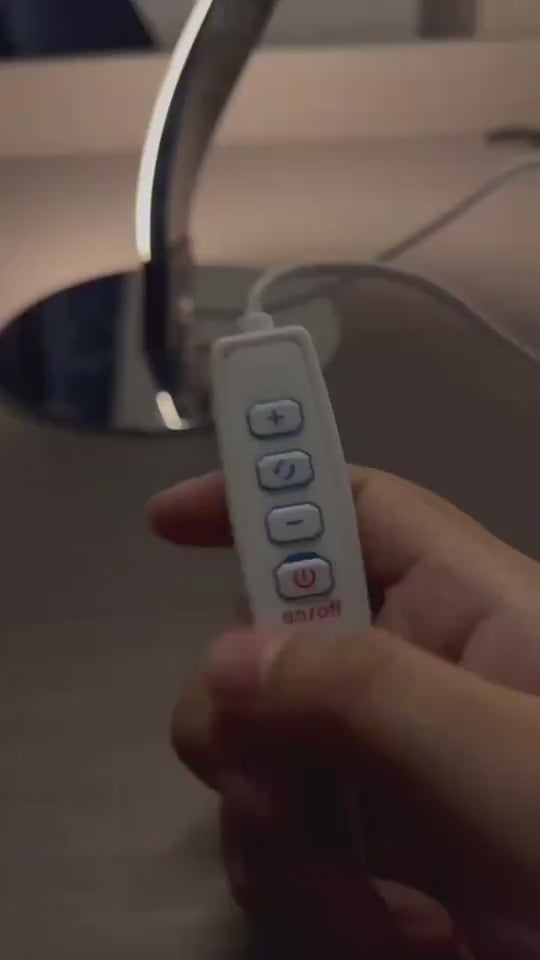 Video demonstration of the Serpentine Spiral LED Lamp showing a hand using the smart inline controller to switch between warm ambient glow, daylight, and dynamic illumination modes on a modern nightstand.